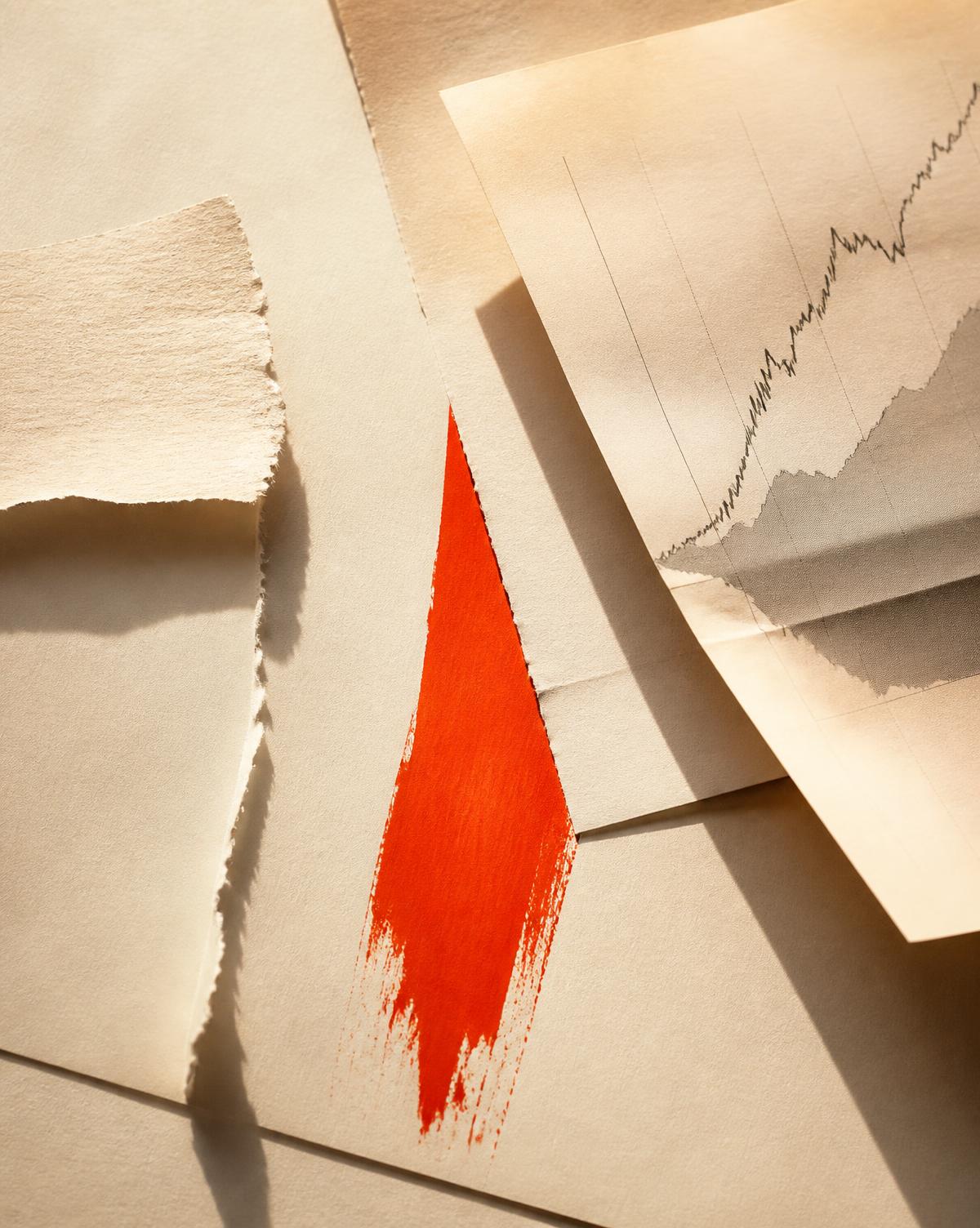 Editorial still life with a vermilion brushstroke